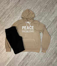 Load image into Gallery viewer, Tan Pullover Peace Over Problems Hoodie With Black Jeans
